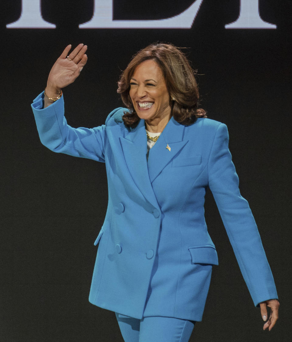 Vice President Kamala Harris waves as she walks on stage during the 30th annual Essence Festival of Culture in New Orleans, Saturday, July 6, 2024. (Matthew Perschall/The Times-Picayune/The New Orleans Advocate via AP)