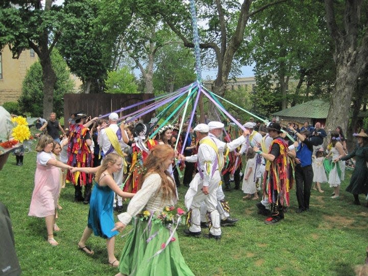 Dancers wrap a 22-foot maypole in Shepherdstown, W.Va.