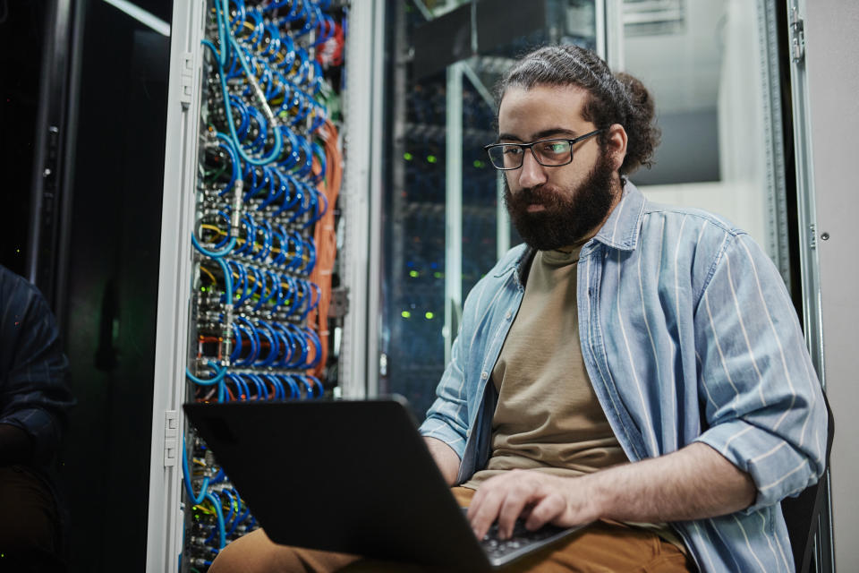 IT guy working in a server room