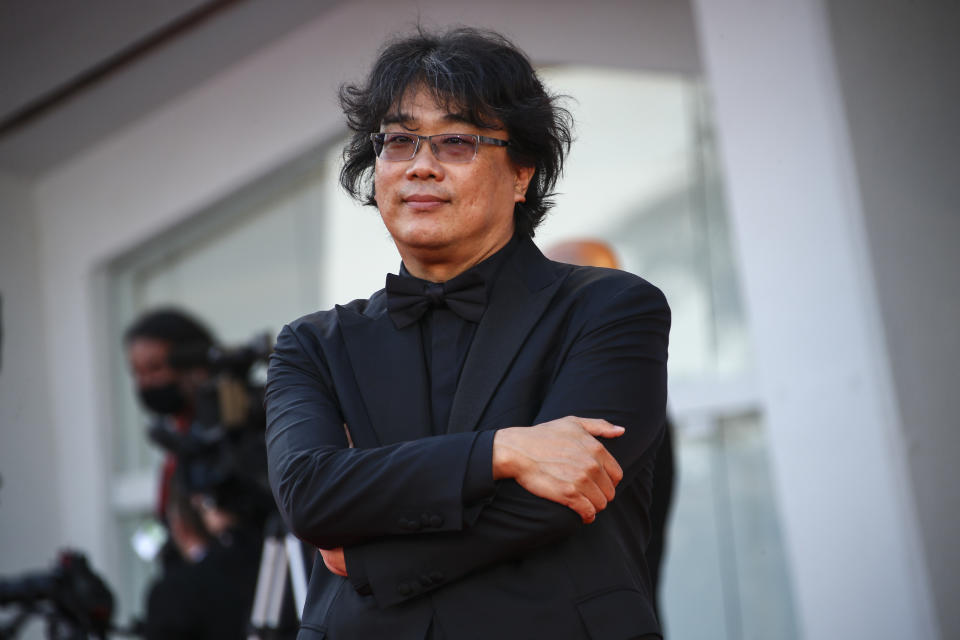 Bong Joon-ho poses for photographers upon arrival at the closing ceremony of the 78th edition of the Venice Film Festival in Venice, Italy, Saturday, Sept. 11, 2021. (Photo by Joel C Ryan/Invision/AP)