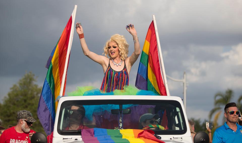 Drag queen Trixie Towers waves to the crowd during the 2019 PRIDE Cape Coral parade.