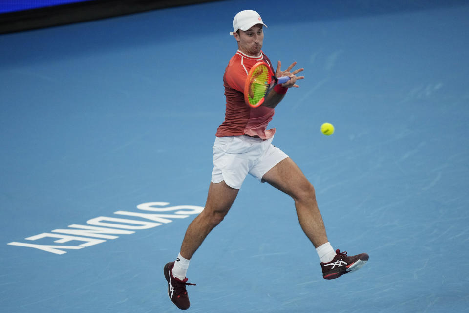 Canada's Steven Diez plays a forehand to Chile's Nicolas Jarry during the United Cup tennis tournament in Sydney, Sunday, Dec. 31, 2023. (AP Photo/Rick Rycroft)