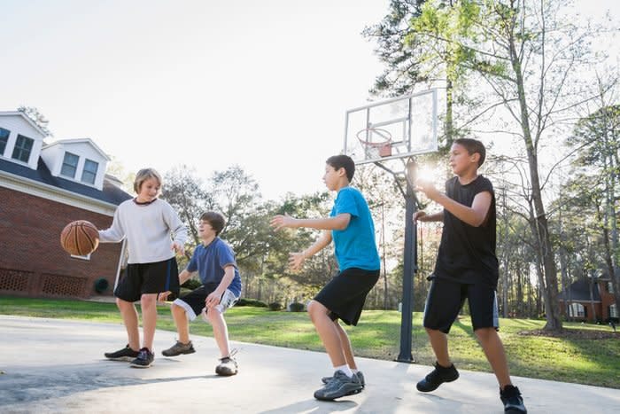 Boys playing basketball