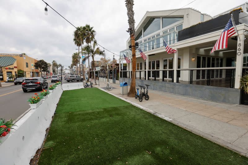 A temporary outdoor space for a restaurant and bar remains empty as new stay-at-home orders begin in Southern California , in San Diego