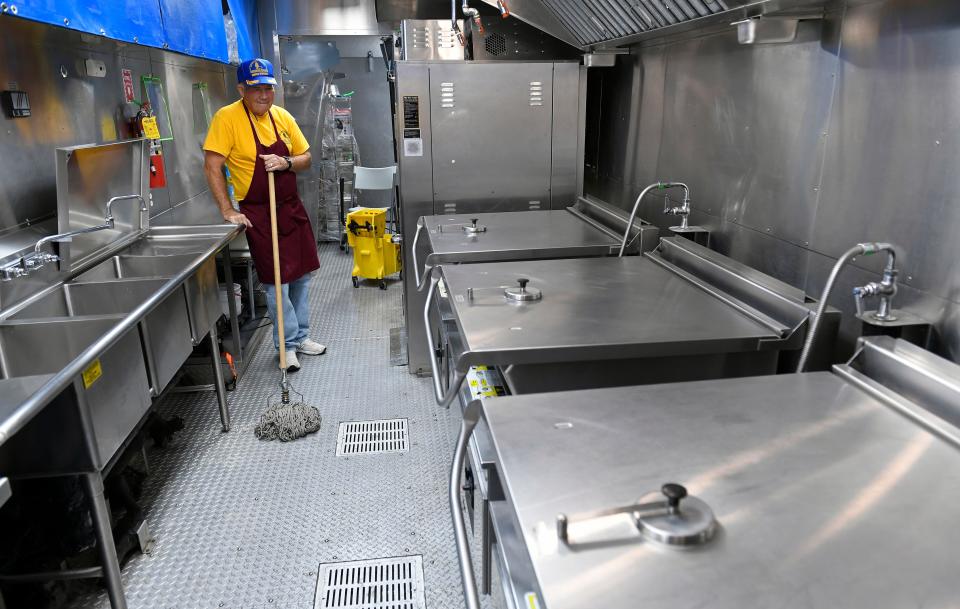 This kitchen on wheels, is a large semi trailer, can produce up to 900 meals a day, here as volunteer Ron Turner, of Augusta, Kansas, prepares for the next day's meal. The Missouri Baptist Disaster Relief is now in Venice, FL, for a month-long relief effort.