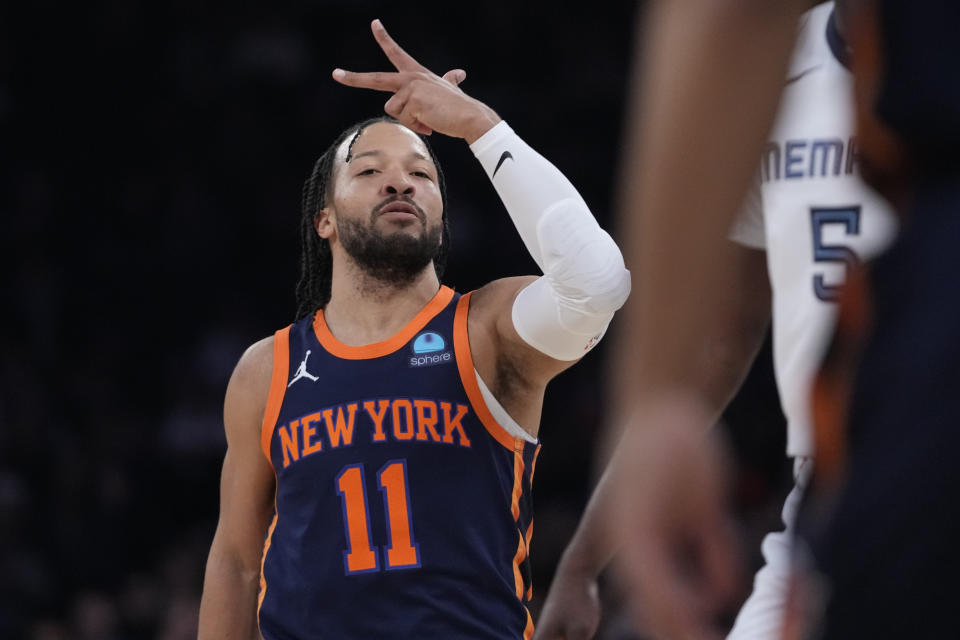 New York Knicks guard Jalen Brunson reacts after shooting a three-point basket during the first half of an NBA basketball game against the Memphis Grizzlies, Tuesday, Feb. 6, 2024, at Madison Square Garden in New York. (AP Photo/Mary Altaffer)