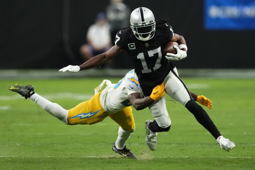 Las Vegas Raiders wide receiver Davante Adams (17) carries on a pass reception against Los Angeles Chargers.