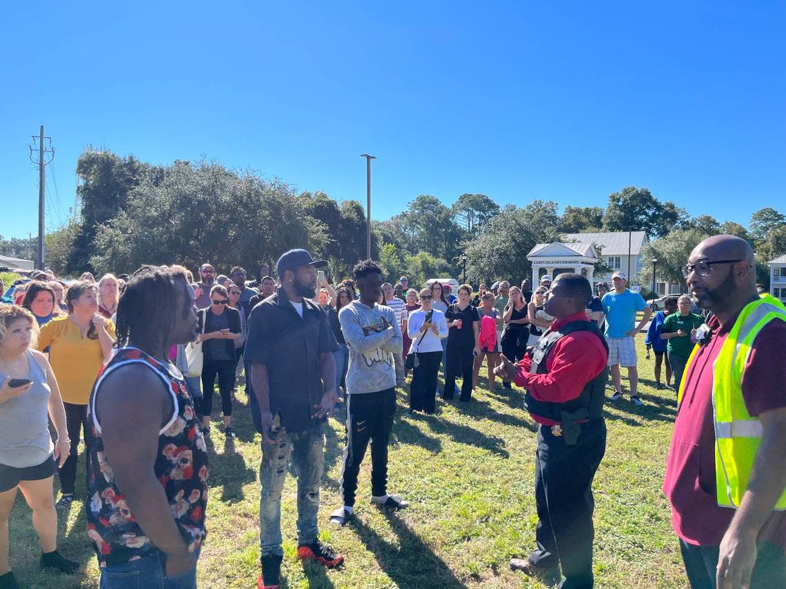 A crowd gathers outside of Beaufort High School after a report of shots fired in the area Wednesday morning. Capt. Andre Massey of the Port Royal Police Department fielded questions from parents and guardians.