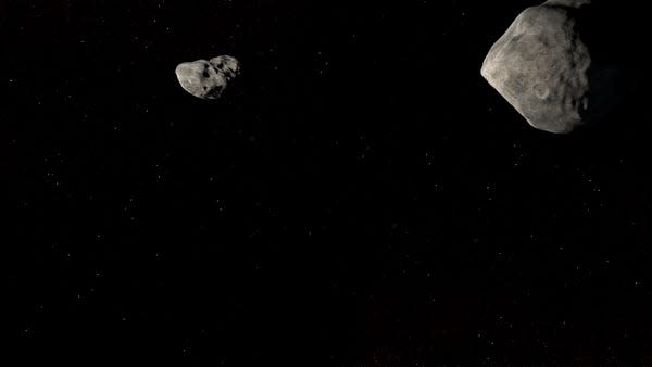 An animation looking from behind as NASA's first planetary defense test mission, the Double Asteroid Redirection Test (DART), collides with the asteroid moonlet Dimorphos.