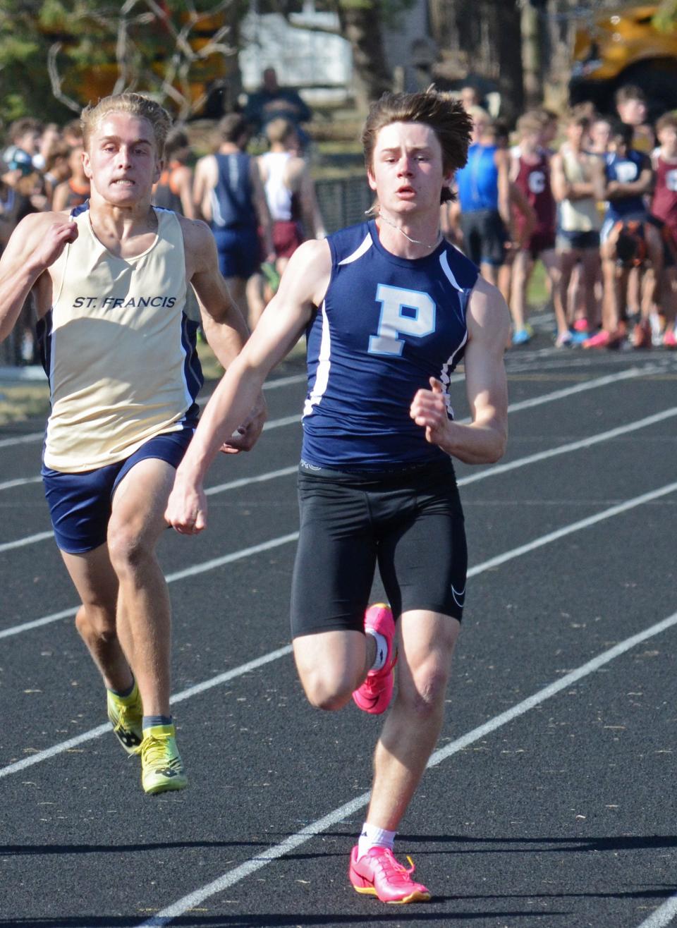 Petoskey's Sam Mitas sprints in the opening leg of the 100 meter dash. Mitas placed third overall in the race of more than 80 runners.