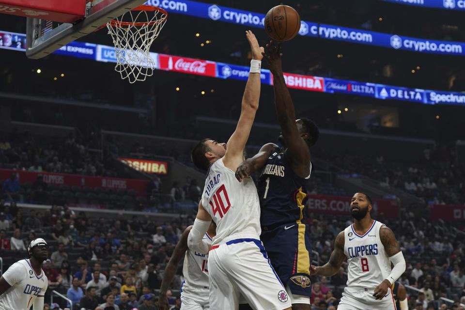 New Orleans Pelicans forward Zion Williamson drives to the basket against Los Angeles Clippers center Ivica Zubac during the first half of an NBA basketball game on Sunday, Oct. 30, 2022, in Los Angeles, Calif. (AP Photo/Allison Dinner)