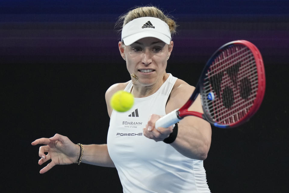 Germany's Angelique Kerber plays a forehand to Italy's Jasmine Paolini during the United Cup tennis tournament in Sydney, Saturday, Dec. 30, 2023. (AP Photo/Rick Rycroft)