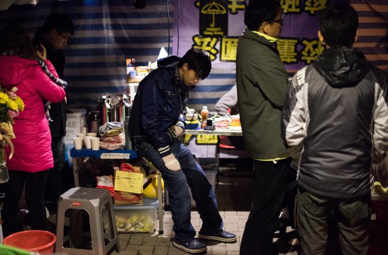 Leader of the student group Scholarism, Joshua Wong sits before attending a press conference at the pro-democracy movement's main protest site in the Admiralty district of Hong Kong on December 4, 2014