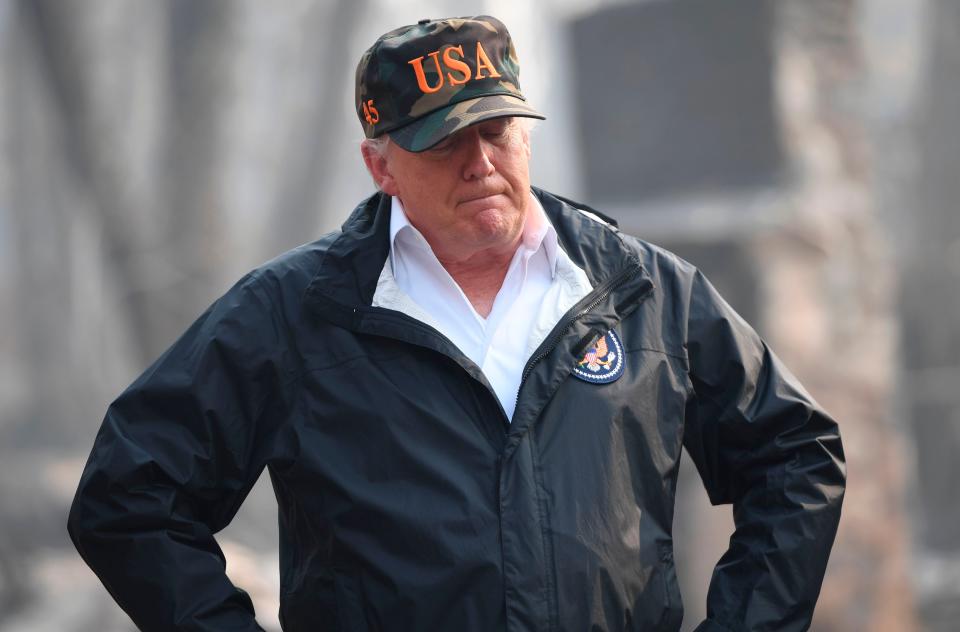 US President Donald Trump looks on as he views damage from wildfires in Paradise, California on November 17, 2018. - President Donald Trump arrived in California to meet with officials, victims and the "unbelievably brave" firefighters there, as more than 1,000 people remain listed as missing in the worst-ever wildfire to hit the US state. (Photo by SAUL LOEB / AFP)SAUL LOEB/AFP/Getty Images ORG XMIT: Trump vis ORIG FILE ID: AFP_1AX5BF