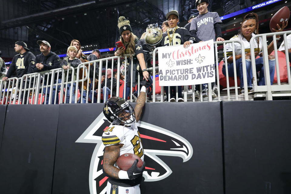 ATLANTA, GEORGIA – NOVEMBER 26: Jamaal Williams #21 of the New Orleans Saints greets fans before the game against the Atlanta Falcons at Mercedes-Benz Stadium on November 26, 2023 in Atlanta, Georgia. (Photo by Kevin C. Cox/Getty Images)