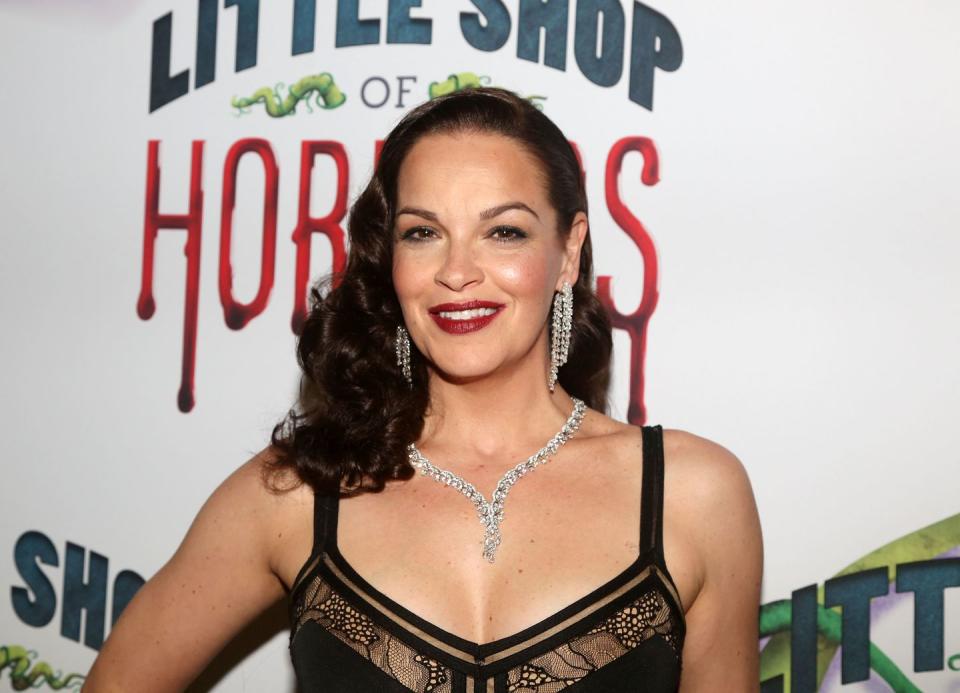 tammy blanchard smiles while attending a red carpet event