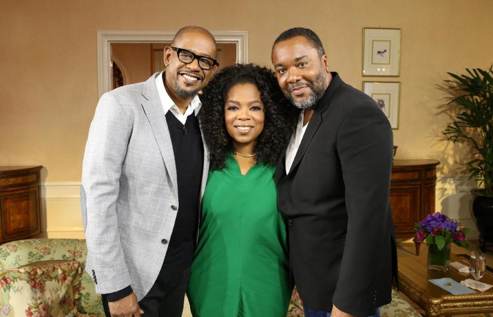 This Aug. 1, 2013 photo released by Harpo Studios, Inc., shows, from left, Forest Whitaker, Oprah Winfrey, and director Lee Daniels, from "Lee Daniels' The Butler," at the Waldorf Astoria in New York. The film opens nationwide on Aug. 16. (AP Photo/Harpo Studios, Inc., George Burns)