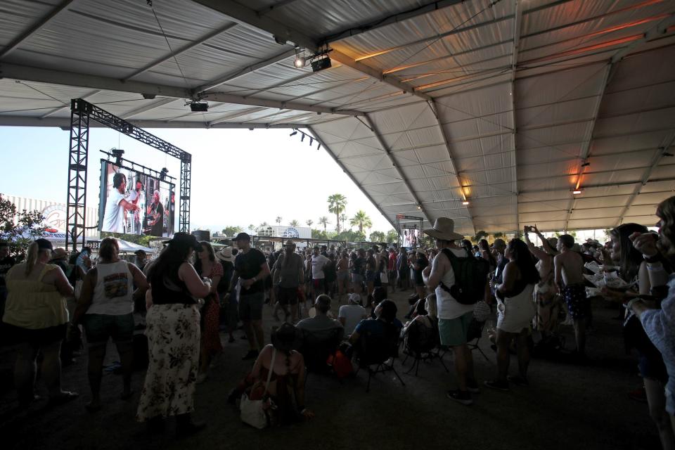 People pack the Stagecoach Smokehouse to see Old Dominion and Guy Fieri do a cooking demo during Stagecoach country music festival at the Empire Polo Club in Indio, Calif., on Saturday, April 29, 2023.