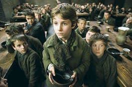 Orphaned at an early age, Oliver Twist (Barney Clark) is forced to live in a workhouse lorded over by the awful Mr. Bumble, who cheats the boys of their meager rations in "Oliver Twist," directed by Roman Polanski. Columbia Pictures | Associated Press