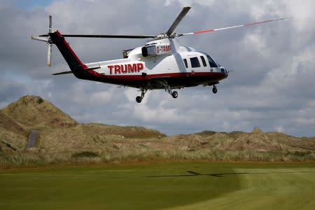 The helicopter of Republican presidential candidate Donald Trump lands on the golf course at his Trump International Golf Links in Aberdeen, Scotland, June 25, 2016. REUTERS/Carlo Allegri