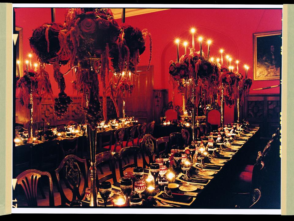 The wedding-banquet table is set with Waterford crystal, Wedgwood china, and centerpieces designed by Hayley Newstead, executed by Absolute Flowers.