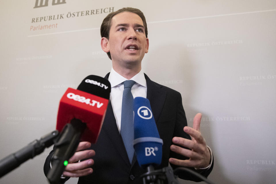 Sebastian Kurz, the former Austrian Chancellor, gives an interview to the press, before the sworn-in as deputy in the Austrian Parliament in Vienna, Austria, Thursday, Oct. 14, 2021. (AP Photo/Lisa Leutner)