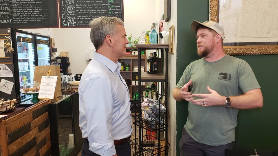 NC Attorney General Josh Stein, left, listens to Brian Graybill, owner of Pan Restaurant, during Stein's visit to the restaurant in downtown Fayetteville on Oct. 12, 2023. Stein, a candidate for governor, dropped by Pan to highlight North Carolina's small businesses as part of his ‘NC Strong’ tour.