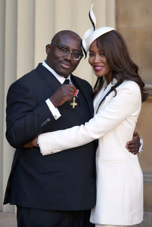 FILE PHOTO: Model Naomi Campbell (R) poses for a photograph with fashion stylist Edward Enninful, after Enninful received his Officer of the Order of the British Empire (OBE) at Buckingham Palace, in London, Britain October 27, 2016. REUTERS/Philip Toscano/Pool/File Photo