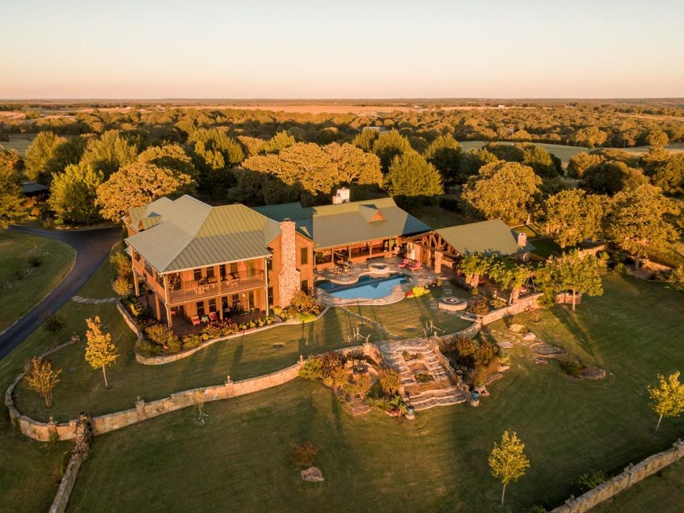 An overhead shot shows Terry Bradshaw's house, pool, and woodsy yard in Oklahoma.