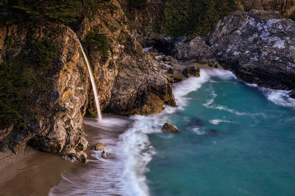 High angle view of rocks in sea at McWay Falls in California