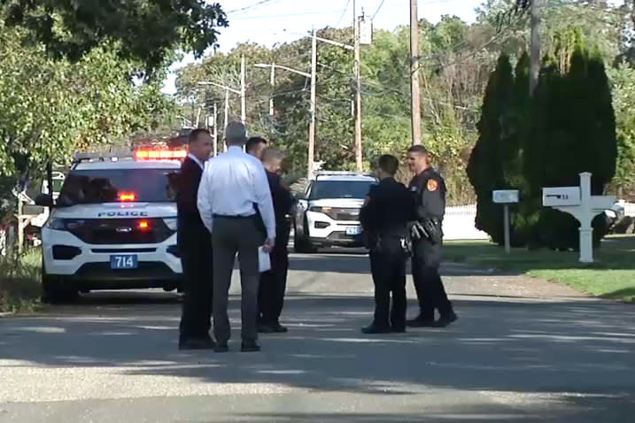 Police officers near the home of Rep. Lee Zeldin after a shooting in Long Island, N.Y., on Sunday. (NBC 4 New York)