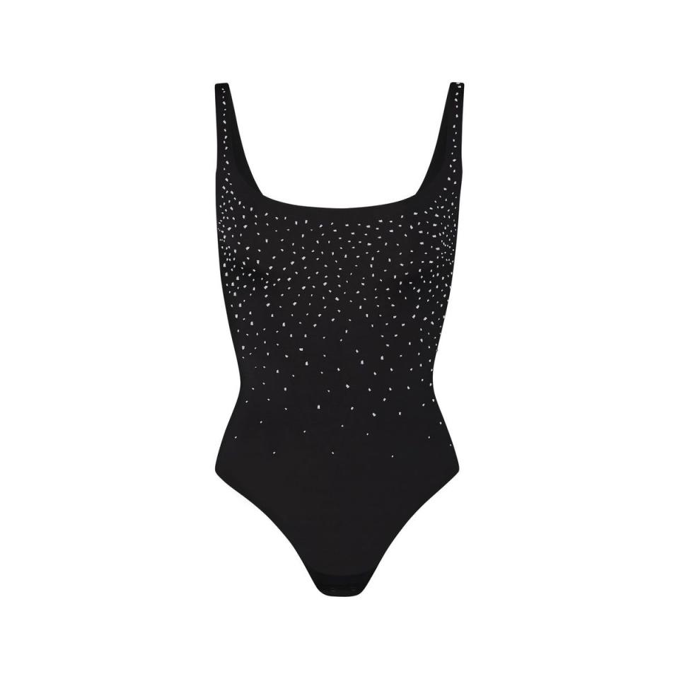 <p><a href="https://go.redirectingat.com?id=74968X1596630&url=https%3A%2F%2Fskims.com%2Fproducts%2Fswarovski-x-skims-jelly-sheer-square-neck-bodysuit-onyx&sref=https%3A%2F%2F" rel="nofollow noopener" target="_blank" data-ylk="slk:Shop Now;elm:context_link;itc:0;sec:content-canvas" class="link ">Shop Now</a></p><p>Jelly transparent Square Neck Bodysuit</p><p>skims.com</p><p>$138.00</p>