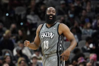 Brooklyn Nets guard James Harden smiles after scoring against the San Antonio Spurs during the second half of an NBA basketball game Friday, Jan. 21, 2022, in San Antonio. (AP Photo/Eric Gay)