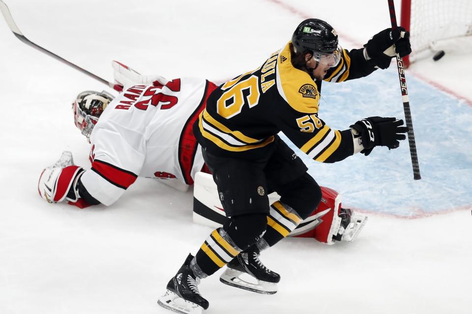 Boston Bruins' Erik Haula (56) celebrates his goal on Carolina Hurricanes goalie Antti Raanta (32) during the third period in Game 6 of an NHL hockey Stanley Cup first-round playoff series Thursday, May 12, 2022, in Boston. (AP Photo/Michael Dwyer)