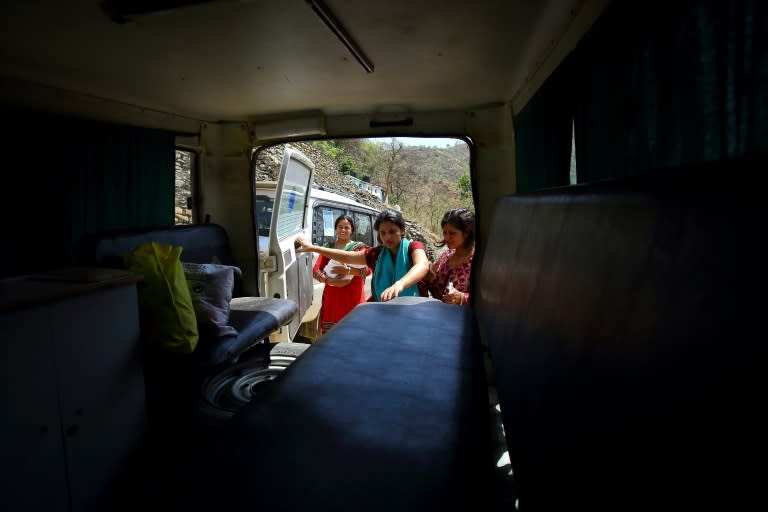 Pabitra Dhungel getting into an ambulance a day after giving birth at a health centre in Ramechhap district, east of Kathmandu