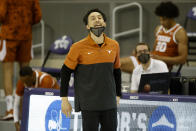 Texas head coach Shaka Smart directs his team against TCU during the first half of an NCAA college basketball game in Fort Worth, Texas, Sunday, March 7, 2021. (AP Photo/Michael Ainsworth)