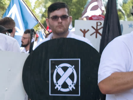 FILE PHOTO: James Alex Fields Jr., attends the "Unite the Right" rally in Emancipation Park, before being arrested by police and charged with charged with one count of second degree murder, three counts of malicious wounding and one count of failing to stop at an accident that resulted in a death after police say he drove a car into a crowd of counter-protesters later in the afternoon in Charlottesville, Virginia, U.S., August 12, 2017. REUTERS/Eze Amos/File Photo