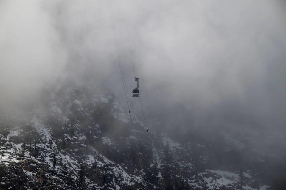 The Base to Base gondola climbs the mountain from Palisades Tahoe on its way to Alpine on Thursday, Dec. 21, 2023. Many Tahoe-area ski resorts have limited runs open due to a lack of snow and warmer temperatures.