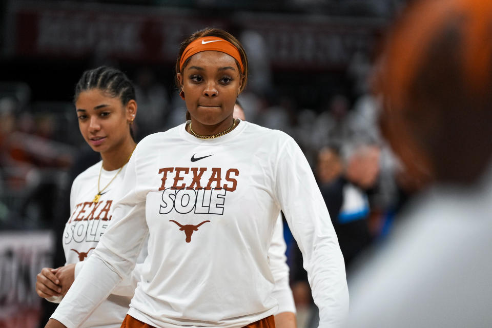 Texas' Aaliyah Moore walks the court during warmups ahead of the second-round NCAA Tournament game against Louisville at Moody Center in March. She has been working her way back from the knee injury that cut short her sophomore season. Moore hasn't been cleared to fully return just yet.