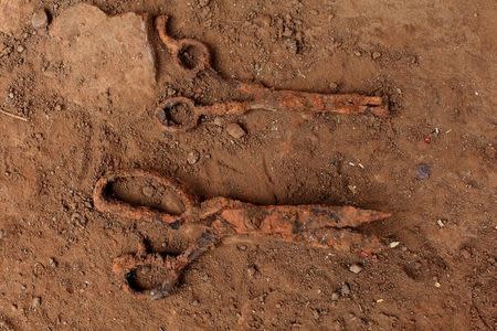 Scissors found at an exhumation site are photographed in the village of El Mozote, Meanguera, El Salvador, March 30, 2017. REUTERS/Jose Cabezas