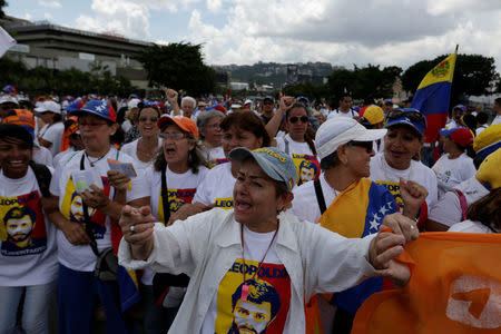 Opposition supporters shout slogans as they take part in a rally to demand a referendum to remove Venezuela's President Nicolas Maduro in Caracas, Venezuela October 22, 2016. REUTERS/Marco Bello