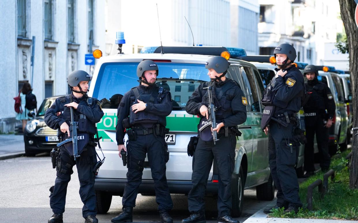 Police officers patrol after police fired shots at a suspicious person near the Israeli Consulate and a museum on the city's Nazi-era history in Munich, Germany