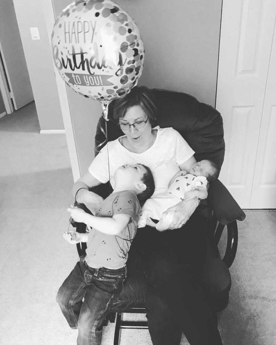 Ashley's mom, Debbie May, spending her birthday helping care for her newborn granddaughter at the time and her grandson, left. Debbie died of leukemia on May 9, 2021. She was 65.