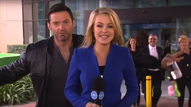 We don’t know about stars being just like us, but some celebrities are at least just like the random people you see in the background of local news reports: They love photobombing. Take <strong>Hugh Jackman</strong>, who photobombed -- or is it videobombed? -- Australian reporter <strong>Jessica Turner</strong> of Channel Ten outside Sydney’s Children’s Hospital. <strong> WATCH: Ashton Kutcher and Mila Kunis Are the Best Photobombers Ever</strong> Hugh was at the hospital to launch Fight Cancer Foundation’s Back on Track program with his wife <strong>Deborra-Lee Furness</strong>. The program is designed to help sick kids keep up with their schoolwork. You can learn out more about Hugh’s visit and Back on Track in Channel Ten’s feature story here (featuring an adorable FaceTime cameo by Hugh’s mother-in-law). <strong> NEWS: Amy Schumer Photobombs a Couple's Adorable Engagement Photos!</strong> Jessica says Hugh and Deborra-Lee stayed at the hospital for about an hour “chatting with nurses and staff” before leaving. Hugh immediately spotted the news crew as he was walking out: YouTube Naturally, he went in for the bomb: YouTube Jessica writes on her blog: <em> “I kind of heard someone yelling behind me,but like all reporters, I’m practiced at blocking out any background craziness and staying focused, so I carried on.. Until the Wolverine practically had his arms around me! ‘Photobomb!’ Hugh yelled. I was so shocked, I couldn’t believe this mega-star just punked me! I couldn’t help but laugh.” </em> YouTube “The best kind of photobomb, Hugh!” she laughs good-naturedly. “Sorry,” he calls off camera. Don’t ever apologize for being the best, Hugh. Speaking of, find out how Hugh responded to his wife’s ‘No Angelina Jolie’ rule: