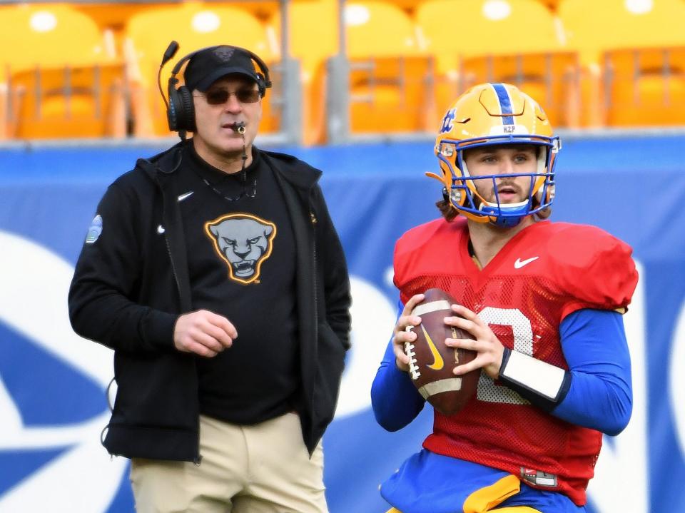 Pat Narduzzi watches as QB Nick Patti prepares to throw the ball during a practice.