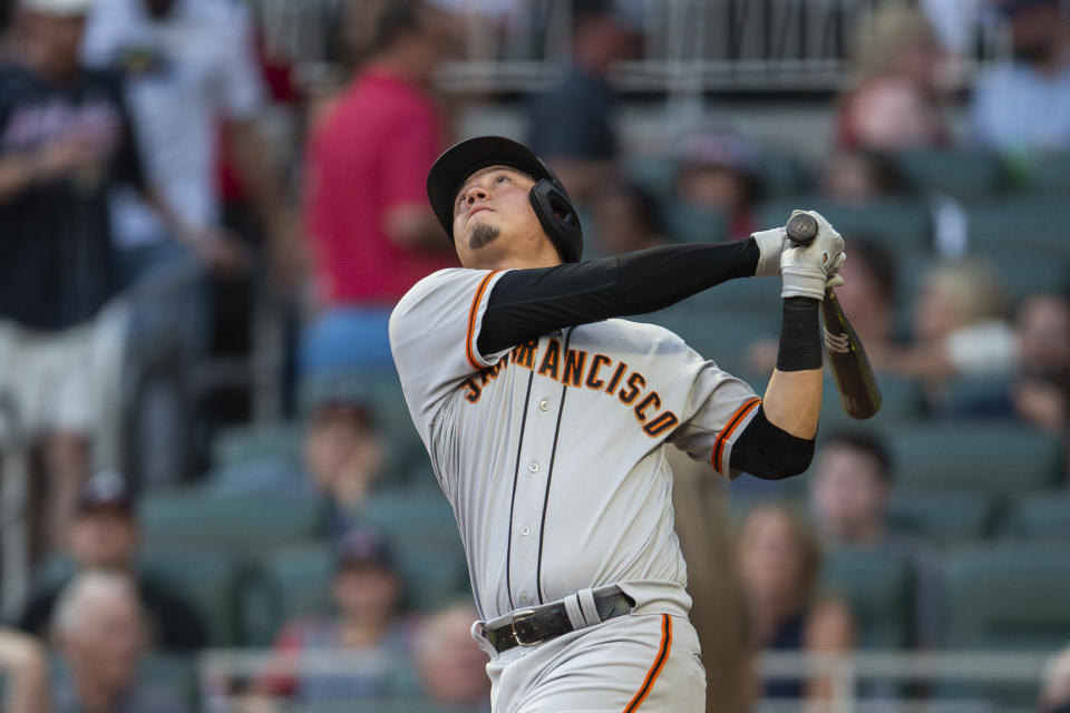 San Francisco Giants Wilmer Flores looks at a fly ball hit in the third inning of a baseball game against the Atlanta Braves Monday, June 20, 2022, in Atlanta. (AP Photo/Hakim Wright Sr.)