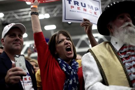 Supporters of Republican presidential nominee Donald Trump cheer at a campaign rally in Manheim, Pennsylvania, U.S., October 1, 2016. REUTERS/Mike Segar