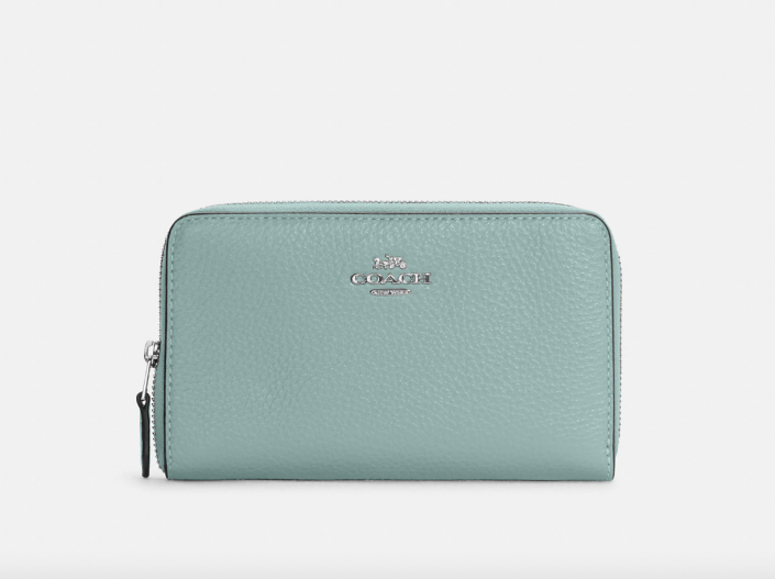 Coach Outlet Medium Id Zip Wallet in Light Teal/Silver (Photo via Coach Outlet)