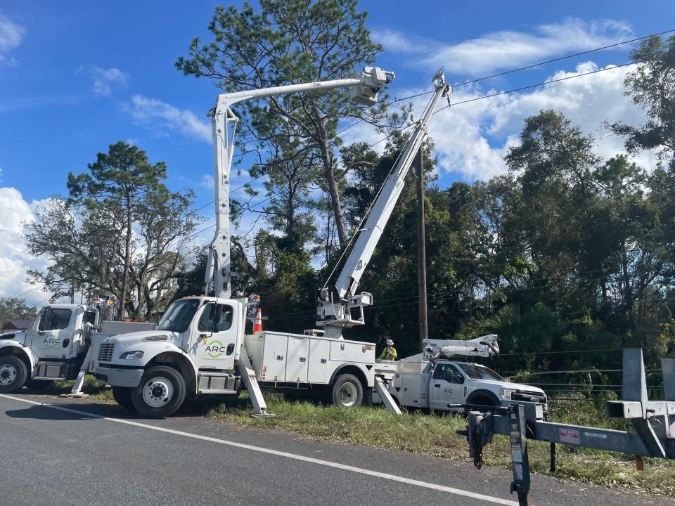 Electrical linemen work on power lines beside U.S. 98 in Dixie County, Florida on August 31, 2023. Dixie County was one of several counties in Florida's Big Bend that Hurricane Idalia left almost completely without power after making landfall on the morning of August 30.