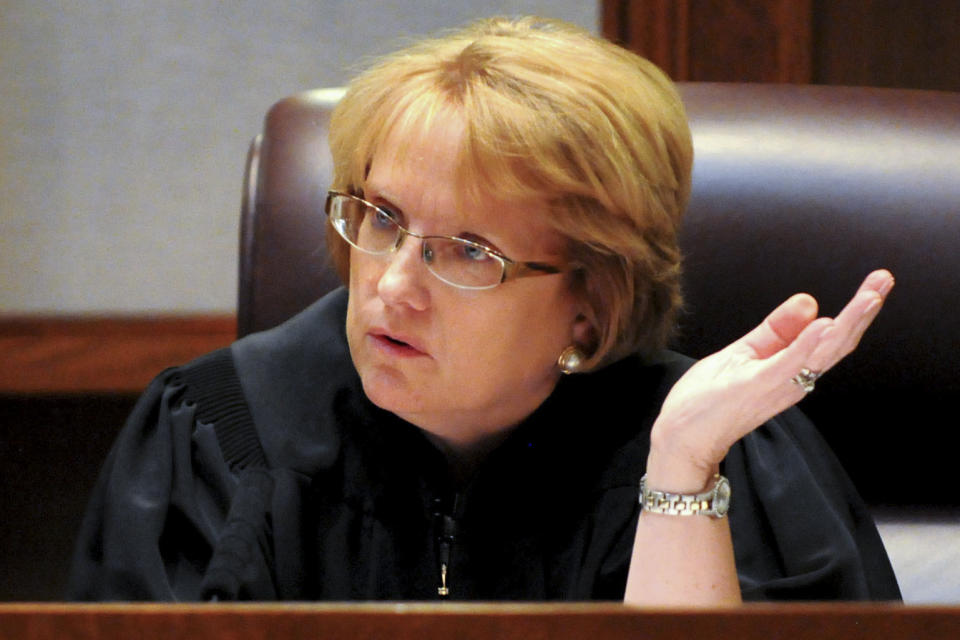 FILE - Chief Justice Lorie Gildea questions attorney Erick Kaardal as the Minnesota Supreme Court listens to oral arguments challenging the Secretary of State and Attorney General changing the titles of constitutional amendment on July 31, 2012. Minnesota courts will allow greater audiovisual coverage of criminal proceedings starting next year under an order filed Wednesday, March 15, 2023, by the Minnesota Supreme Court. Worldwide broadcasts and livestreams of the trial of Chauvin, convicted of murdering murdering George Floyd, were generally seen as a success and led Gildea to launch a process that led to the permanent easing. (AP Photo/John Doman, Pool, File)